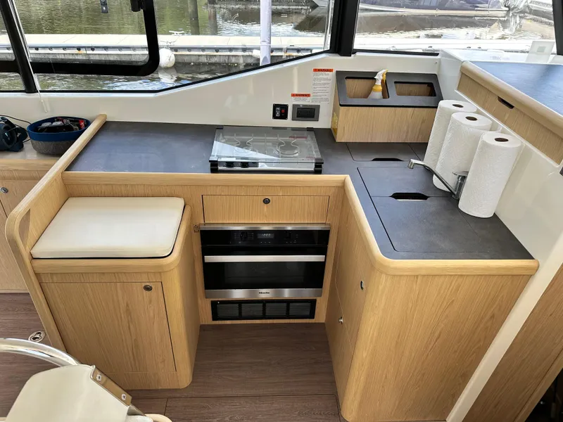 Slide: The Image of Modern kitchen area in a 2022 Beneteau Swift Trawler 35 yacht. - 47