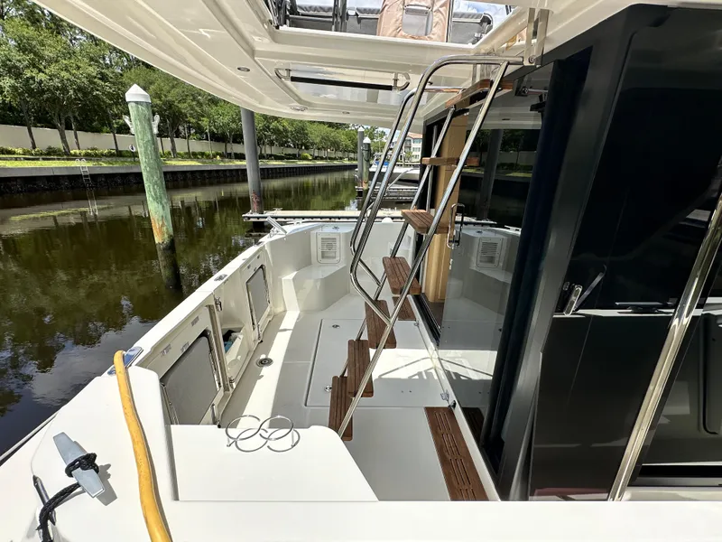 Slide: The Image of 2022 Beneteau Swift Trawler 35, featuring a sleek deck and modern design. - 7