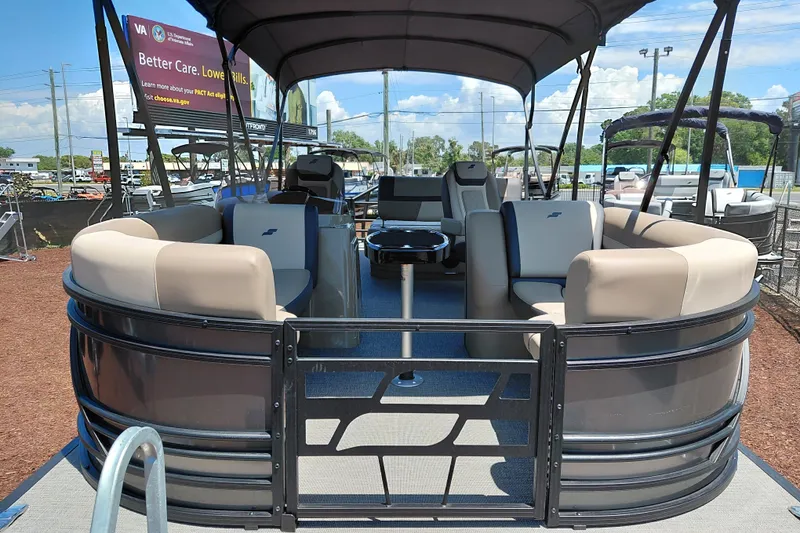 Slide: The Image of 2026 Starcraft EXS 3 Q DH pontoon boat with spacious seating and canopy. - 11