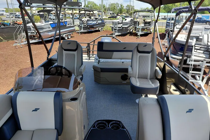 Slide: The Image of 2026 Starcraft EXS 3 Q DH pontoon boat interior with seating and helm. - 14