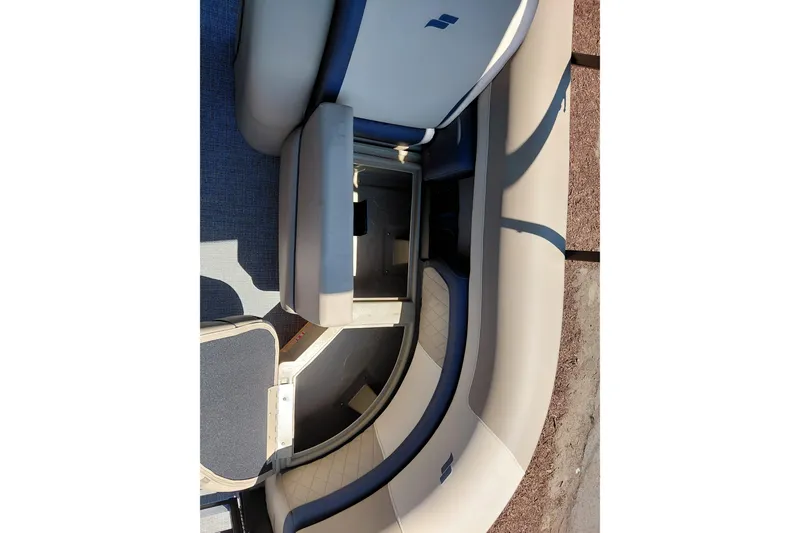 Slide: The Image of 2026 Starcraft EXS 3 Q DH boat interior with open storage compartment. - 17