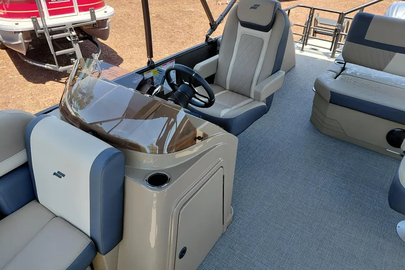 Slide: The Image of Interior of 2026 Starcraft EXS 3 Q DH boat with modern seating and steering console. - 19