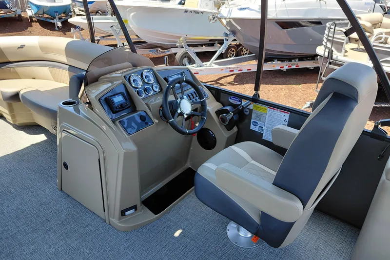 Slide: The Image of Interior view of 2026 Starcraft EXS 3 Q DH boat, featuring modern helm and seating. - 20