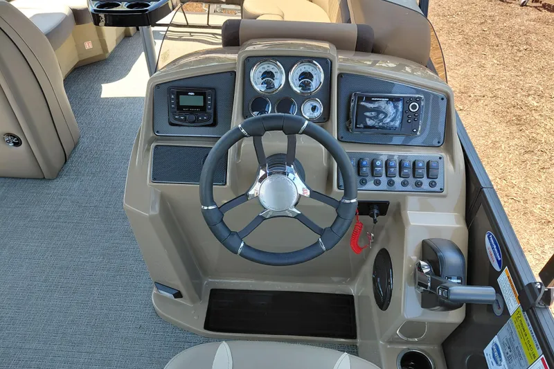 Slide: The Image of Steering console of 2026 Starcraft EXS 3 Q DH boat with modern controls and gauges. - 21