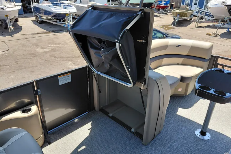 Slide: The Image of 2026 Starcraft EXS 3 Q DH boat interior with seating and storage compartment. - 23