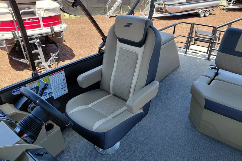 Slide: The Image of Captain's chair in 2026 Starcraft EXS 3 Q DH pontoon boat interior. - 26