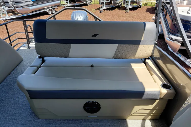 Slide: The Image of 2026 Starcraft EXS 3 Q DH boat seating, beige and gray upholstery, cup holders, outdoor setting. - 29