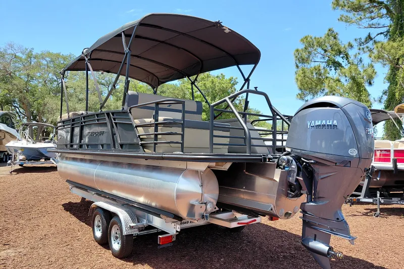 Slide: The Image of 2026 Starcraft EXS 3 Q DH pontoon boat with Yamaha engine on trailer. - 3