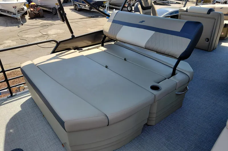 Slide: The Image of 2026 Starcraft EXS 3 Q DH boat interior with adjustable seating and cup holder. - 31