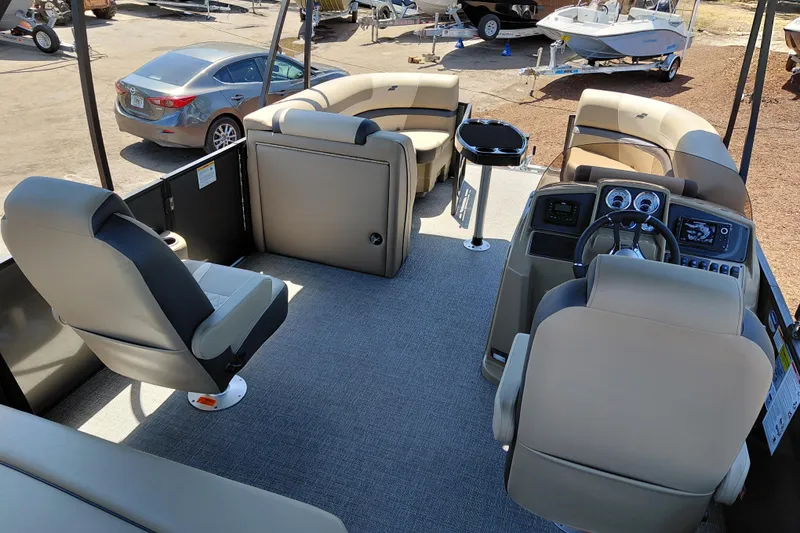 Slide: The Image of 2026 Starcraft EXS 3 Q DH pontoon boat interior with plush seating and modern dashboard. - 39