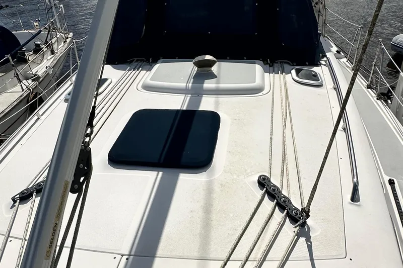 Slide: The Image of 2006 Hunter 41 Deck Salon sailboat deck with rigging and hatches. - 15