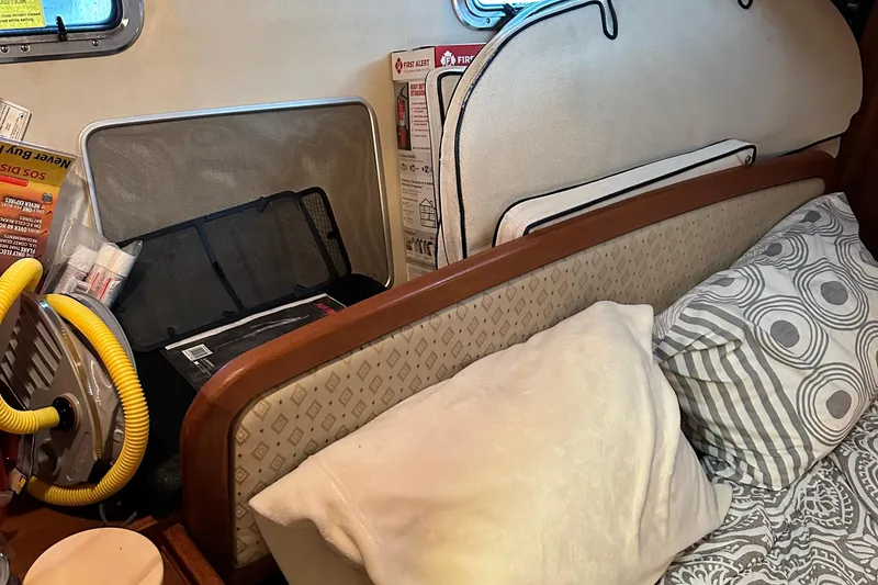 Slide: The Image of Interior of 2006 Hunter 41 Deck Salon with cushions, pillows, and safety equipment. - 42