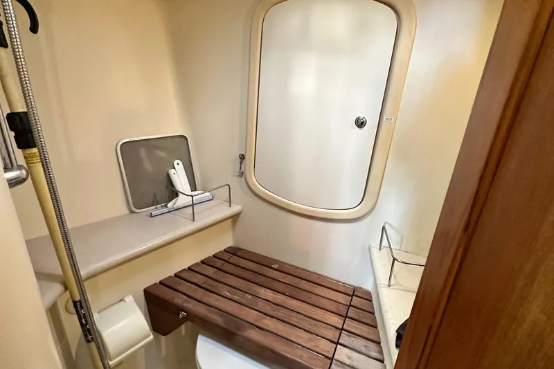 Slide: The Image of Bathroom interior of 2006 Hunter 41 Deck Salon yacht with wooden bench and shower. - 53