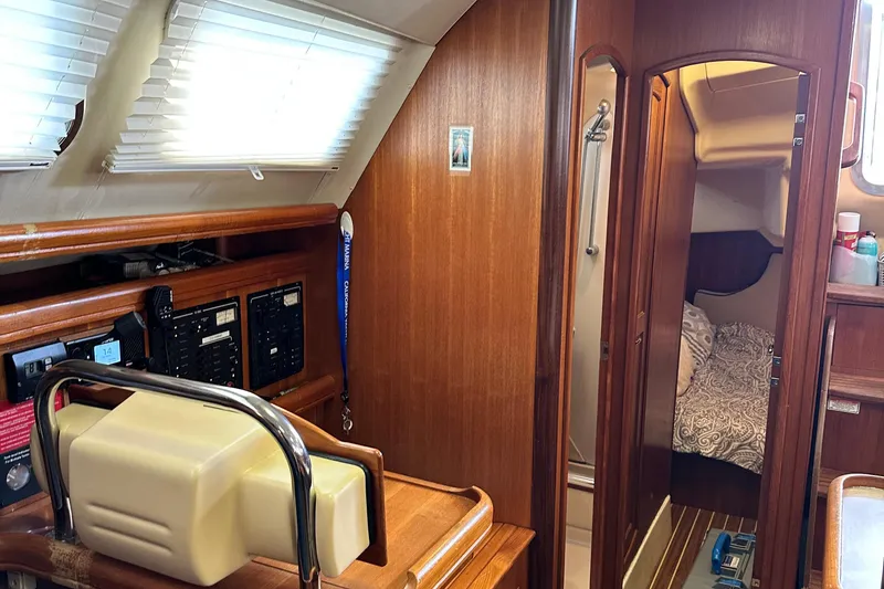 Slide: The Image of Interior of 2006 Hunter 41 Deck Salon yacht with wood paneling and cozy cabin. - 65