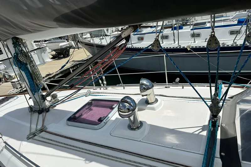 Slide: The Image of Sailboat deck with rigging and chrome vents, Sabre 386, 2007 model, docked at marina. - 26