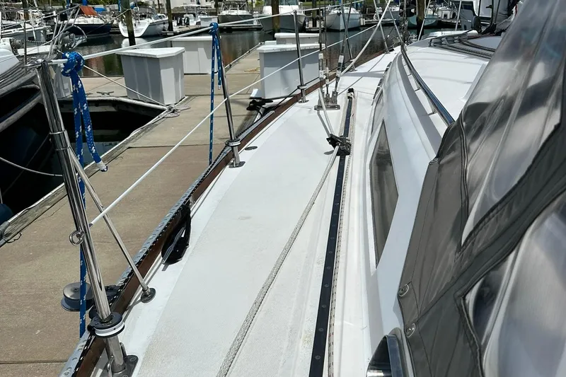 Slide: The Image of 2007 Sabre 386 sailboat docked, showcasing deck and rigging details. - 29