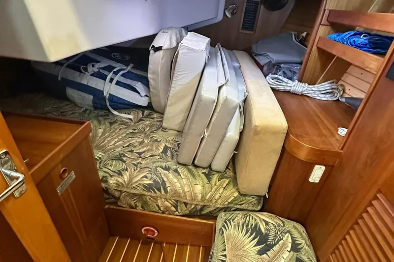 Slide: The Image of Interior of 2007 Sabre 386 sailboat with cushions and storage area. - 53