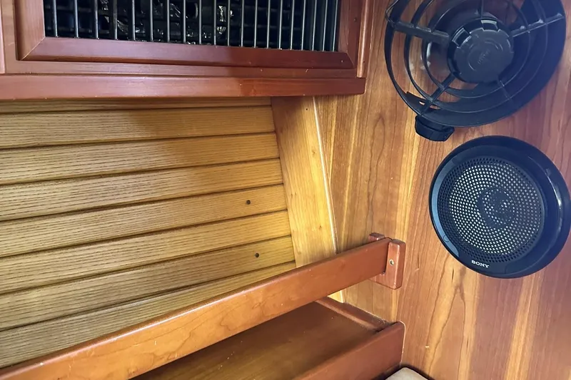 Slide: The Image of Interior of 2007 Sabre 386 with wood paneling and Sony speaker. - 67