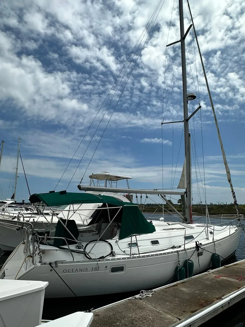 Slide: The Image of Sailboat docked under cloudy sky, Beneteau 381, 1998 model. - 2