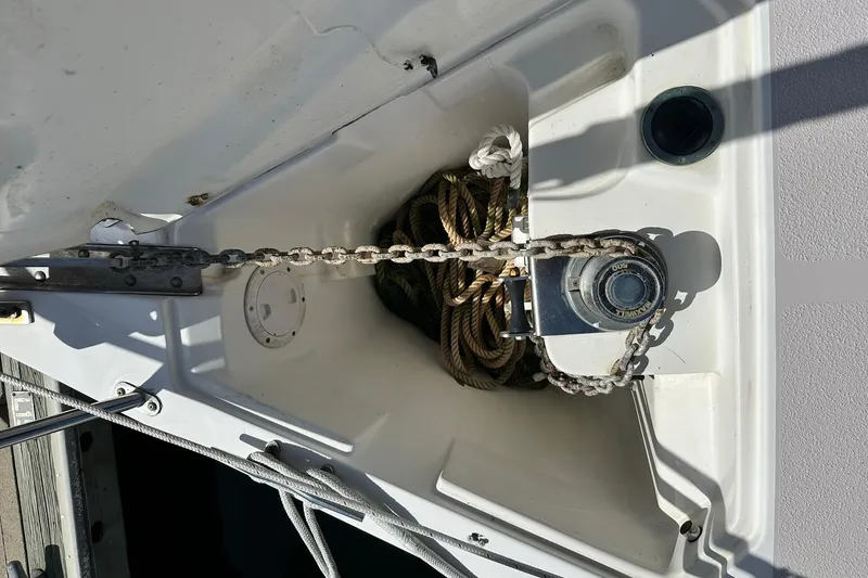Slide: The Image of Anchor chain and winch on a 2008 Catalina 320 sailboat deck. - 24