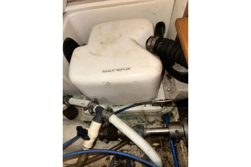 Slide: The Image of Catalina 320 (2008) engine compartment with Aqualift muffler and hoses. - 57
