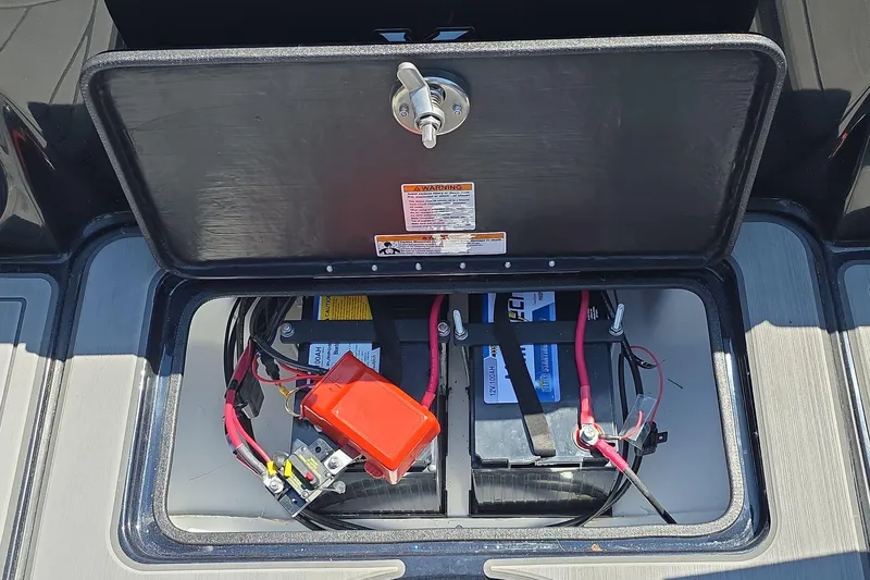 Slide: The Image of Battery compartment of 2026 Yar-Craft 219TFX boat, showcasing wiring and connections. - 10