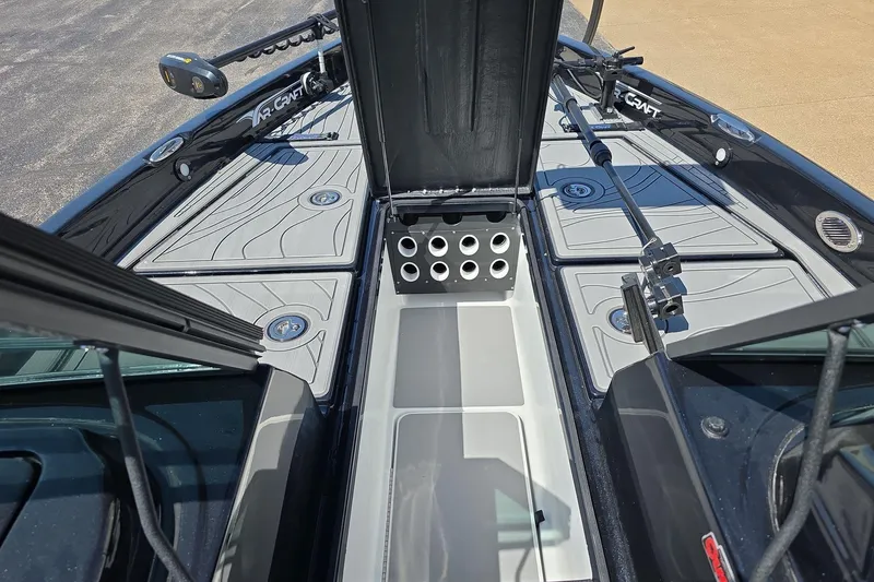 Slide: The Image of 2026 Yar-Craft 219TFX boat deck with storage compartments and fishing rod holders. - 11