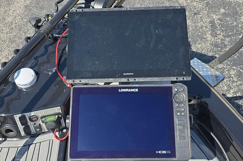 Slide: The Image of 2026 Yar-Craft 219TFX boat with Garmin and Lowrance navigation displays. - 15