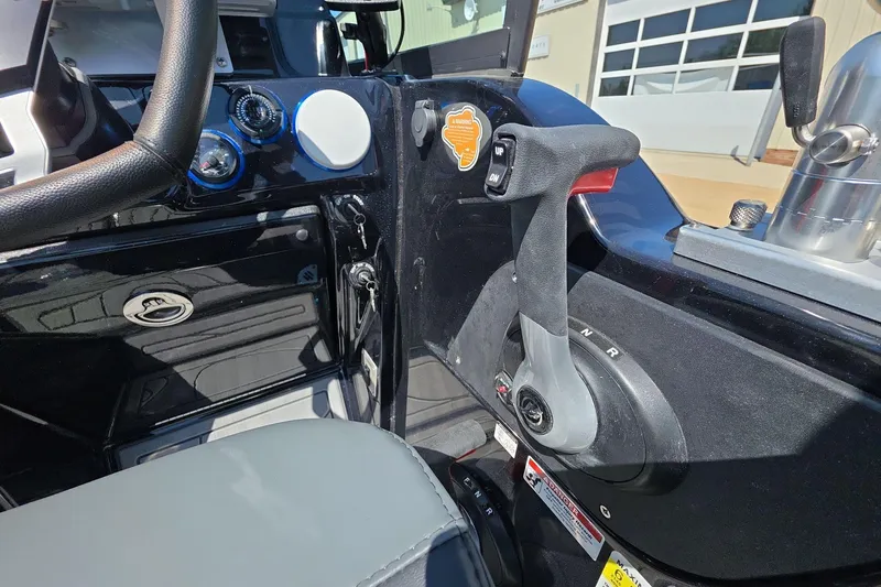 Slide: The Image of 2026 Yar-Craft 219TFX boat cockpit with steering wheel and throttle controls. - 19