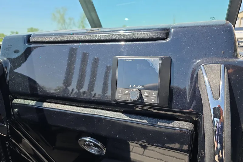 Slide: The Image of JL Audio system on 2026 Yar-Craft 219TFX boat dashboard under sunlight. - 22
