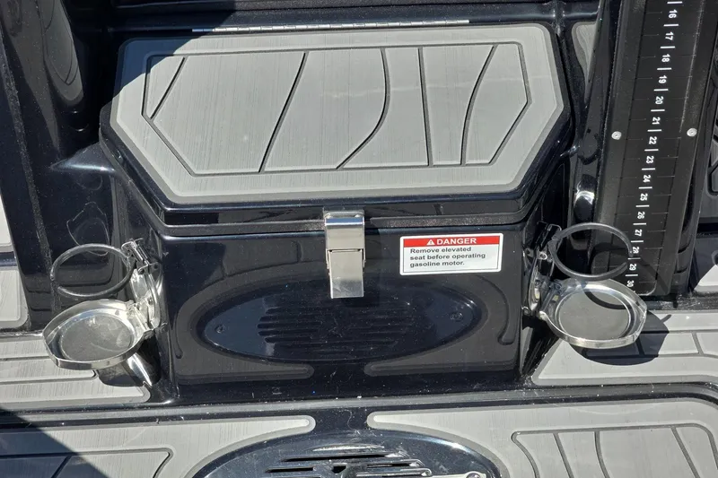 Slide: The Image of 2026 Yar-Craft 219TFX boat deck with cup holders and safety warning label. - 25
