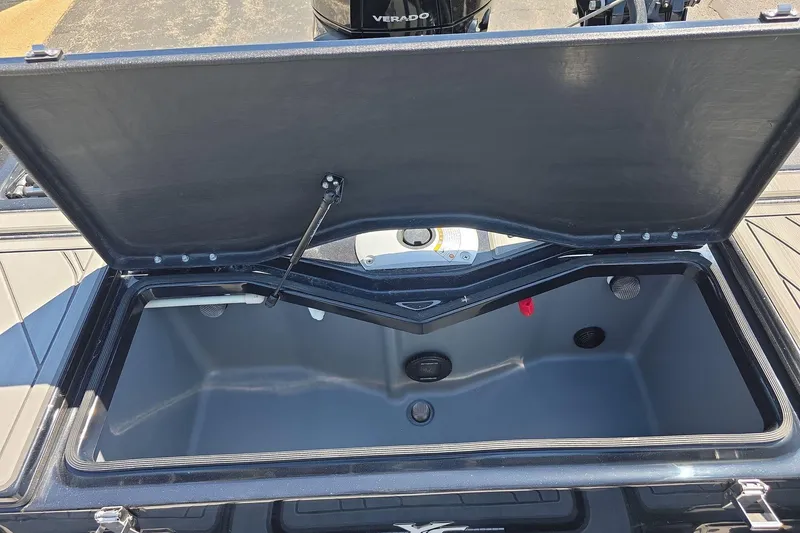 Slide: The Image of Open storage compartment of 2026 Yar-Craft 219TFX boat, showcasing interior space. - 26