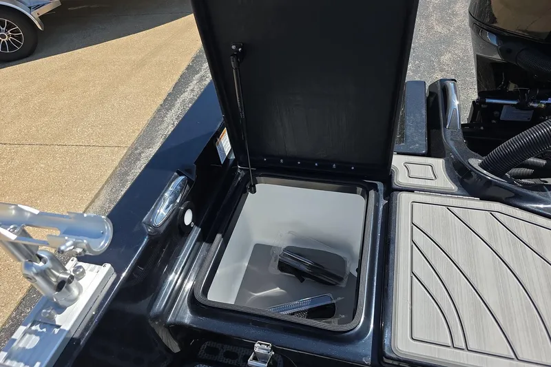 Slide: The Image of Open storage compartment on 2026 Yar-Craft 219TFX boat, showcasing interior space. - 27
