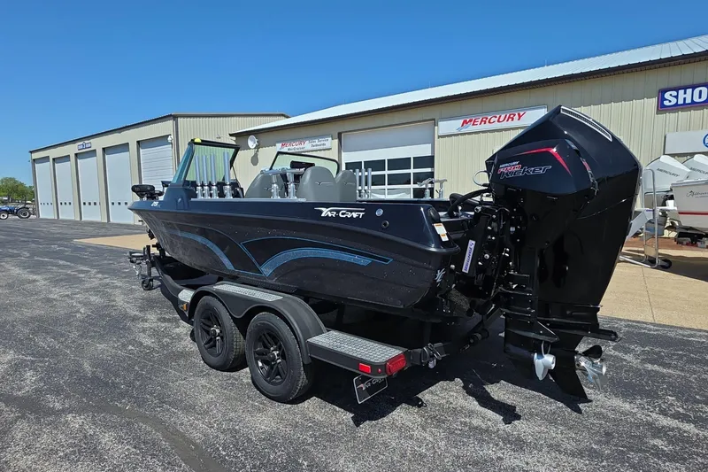 Slide: The Image of 2026 Yar-Craft 219TFX boat with trailer, parked outside a dealership. - 3