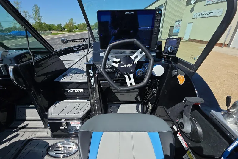 Slide: The Image of Interior of 2026 Yar-Craft 219TFX boat with advanced navigation system and steering controls. - 8