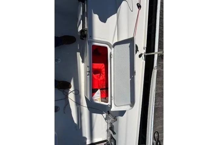 Slide: The Image of Open storage compartment on 2024 Beneteau First 27 sailboat deck. - 8