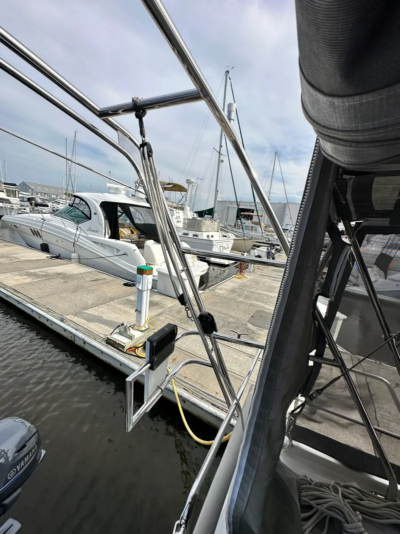 Slide: The Image of 2023 Beneteau Oceanis 46.1 yacht docked at marina, showcasing sleek design and modern features. - 14