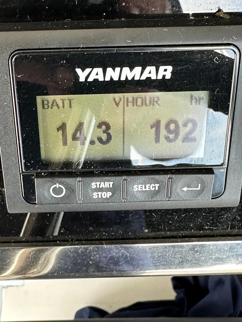 Slide: The Image of Yanmar engine display showing battery voltage 14.3 and hours 192 on Beneteau Oceanis 46.1, 2023. - 32