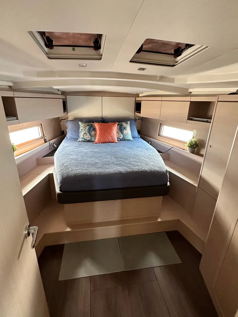 Slide: The Image of Luxurious cabin interior of 2023 Beneteau Oceanis 46.1 yacht, featuring a cozy bed. - 38