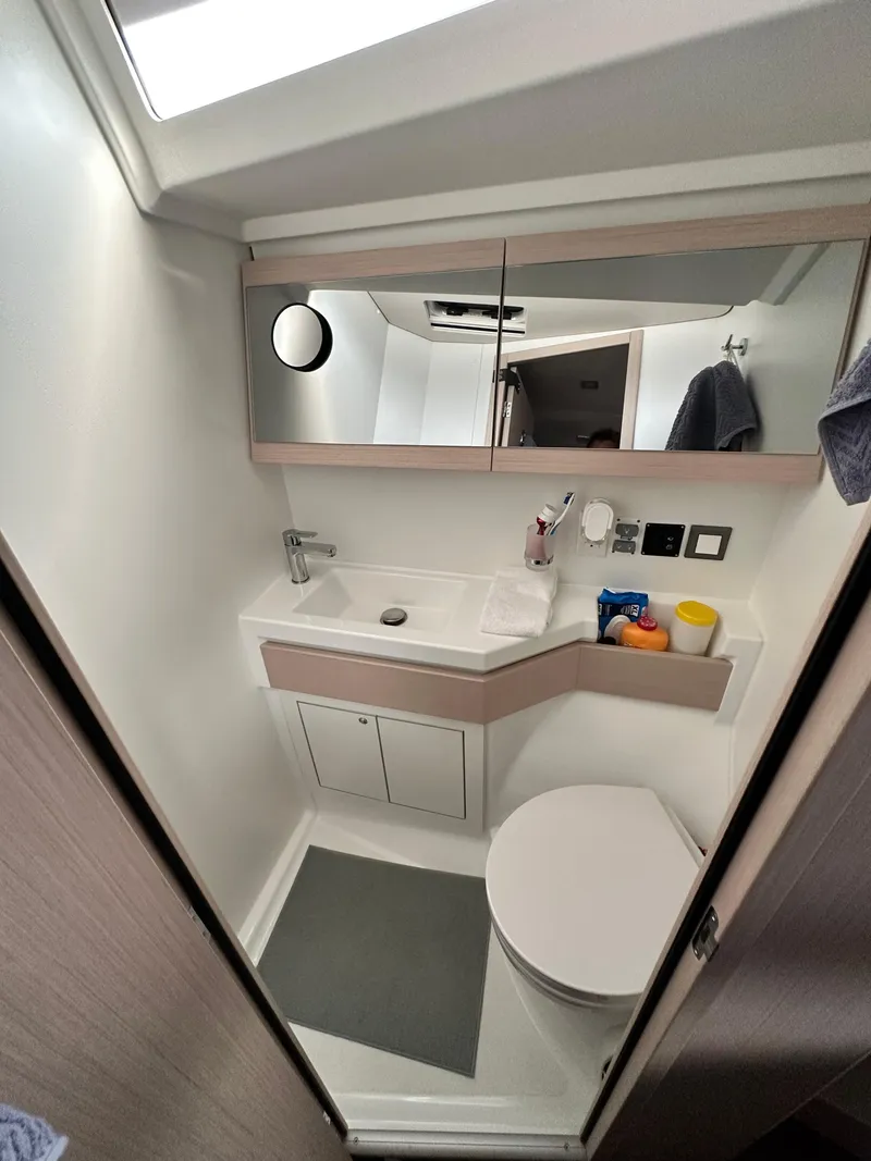 Slide: The Image of Modern bathroom in 2023 Beneteau Oceanis 46.1 yacht, featuring sleek design and compact amenities. - 41