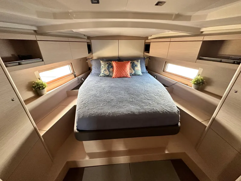 Slide: The Image of Luxurious cabin interior of 2023 Beneteau Oceanis 46.1 yacht with cozy bed and modern decor. - 43