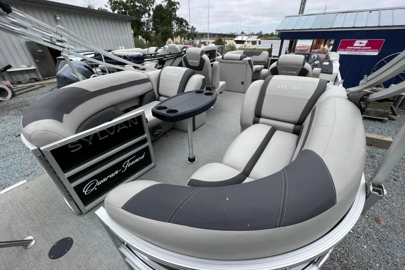 Slide: The Image of 2022 Sylvan L3 LZ pontoon boat with luxurious seating at the dock. - 10