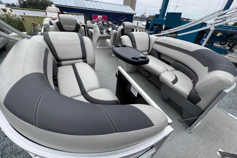 Slide: The Image of Interior of a 2022 Sylvan L3 LZ pontoon boat with gray seating. - 11