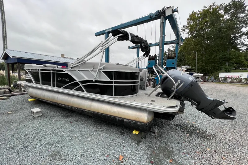 Slide: The Image of 2022 Sylvan L3 LZ pontoon boat with Yamaha outboard motor. - 3