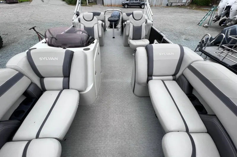Slide: The Image of Interior of a 2022 Sylvan L3 LZ pontoon boat with gray seating. - 4
