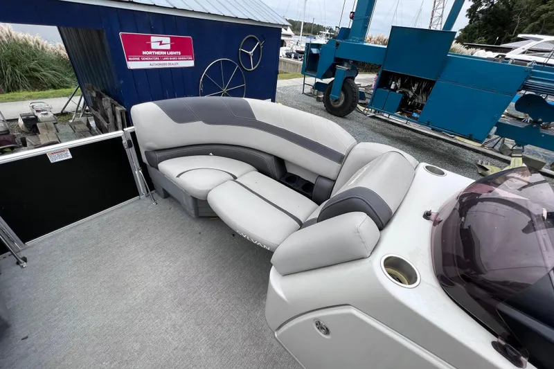 Slide: The Image of Sylvan L3 LZ 2022 pontoon boat with gray seating at the marina. - 6