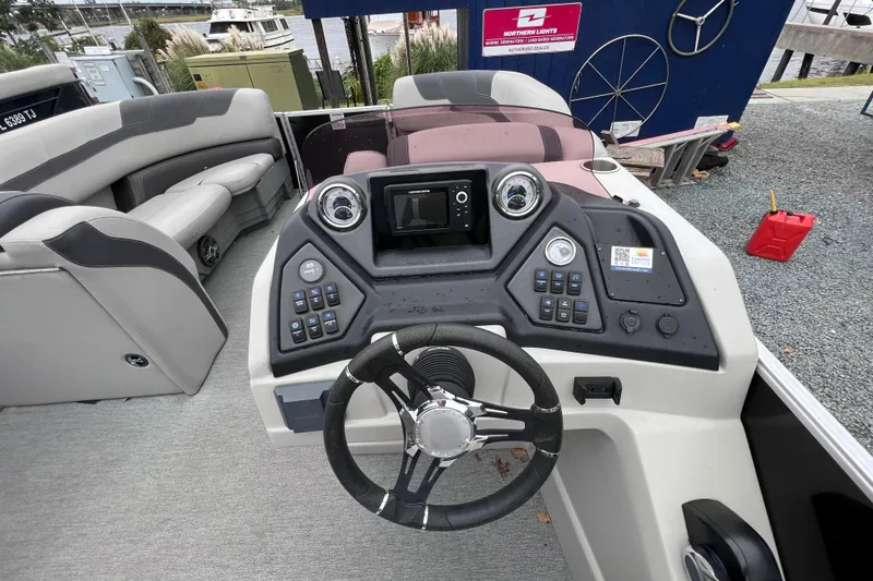 Slide: The Image of Interior view of 2022 Sylvan L3 LZ boat cockpit with controls. - 7