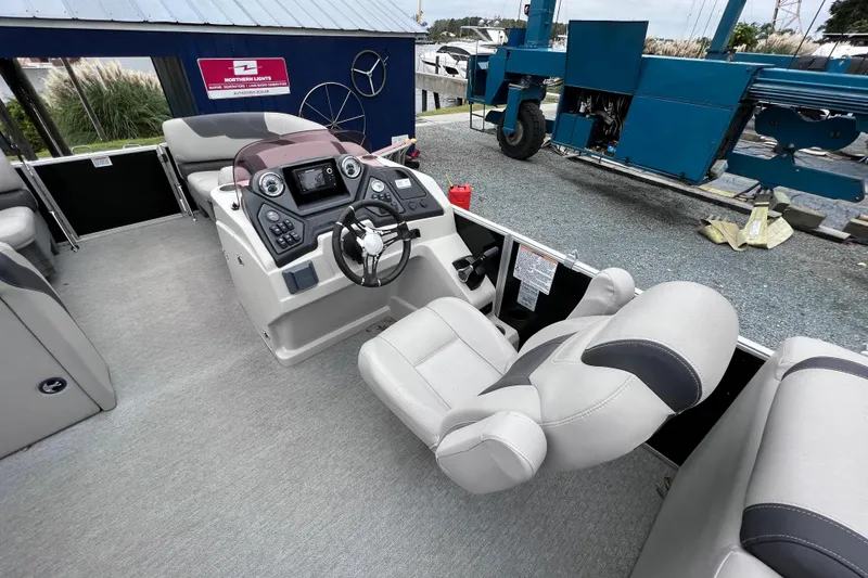 Slide: The Image of Interior of a 2022 Sylvan L3 LZ pontoon boat with helm console. - 9