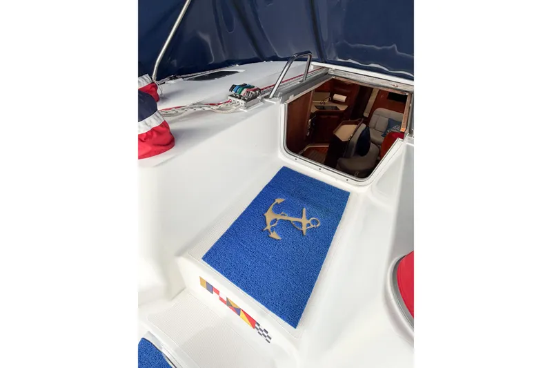 Slide: The Image of Interior view of a 1996 Hunter 430 sailboat with blue mat and anchor design. - 23