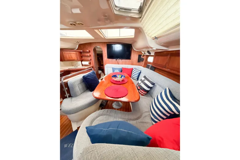 Slide: The Image of Interior of 1996 Hunter 430 yacht with cozy seating and nautical decor. - 33